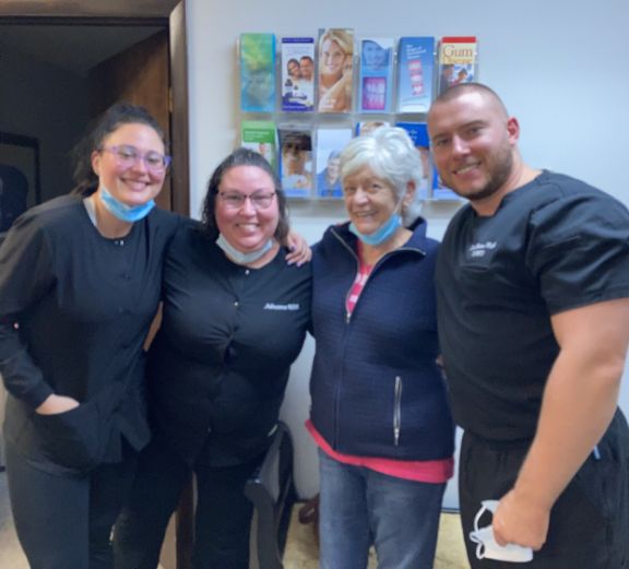 Four dental team members at dental office in Montague